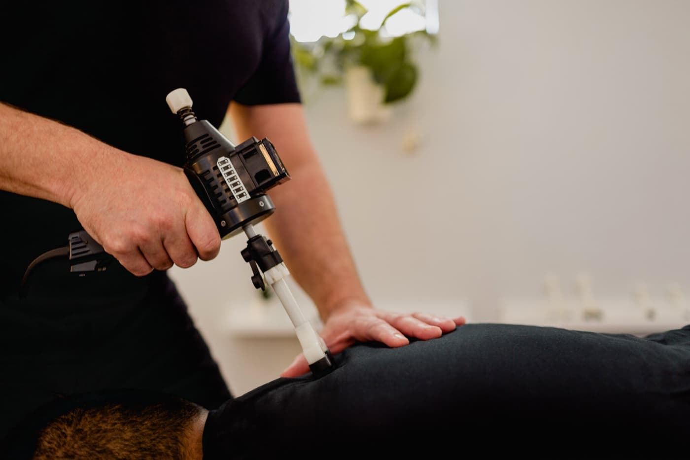 Close-up of a precision adjusting instrument used on a patient's spine