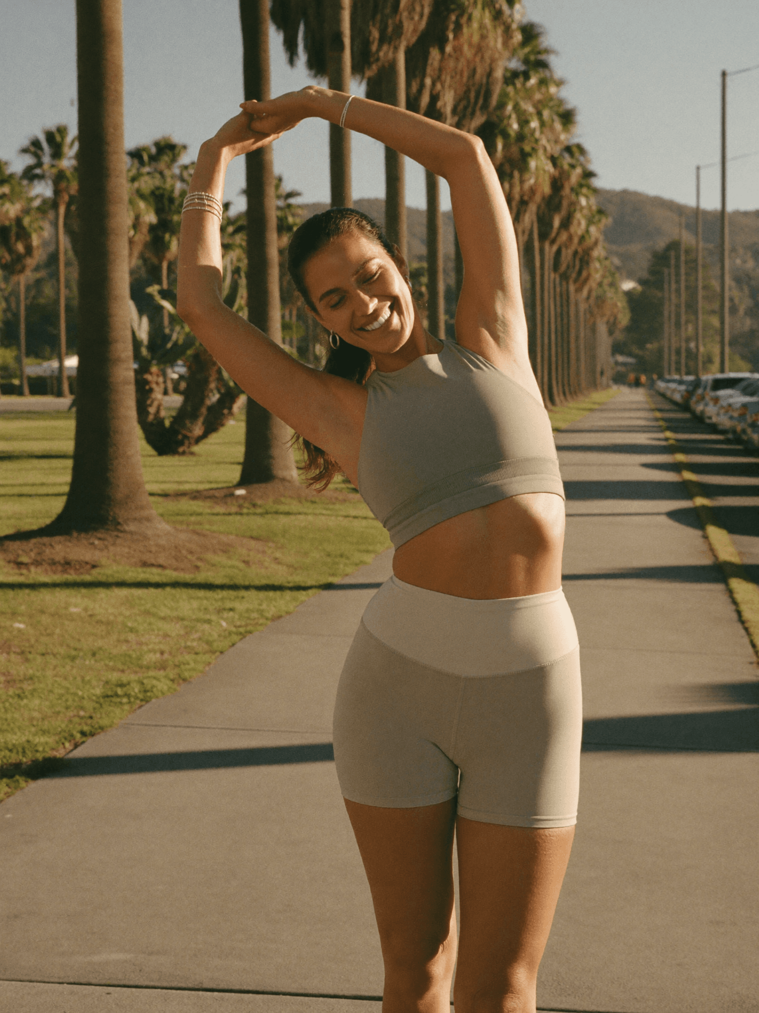 Patient stretching outdoors, active and pain-free after corrective care